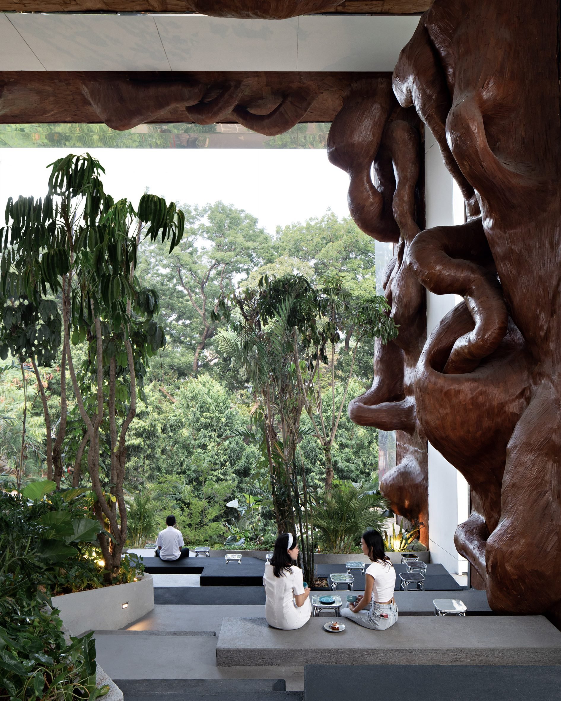 Seating area within public garden shelter by RAD+ar