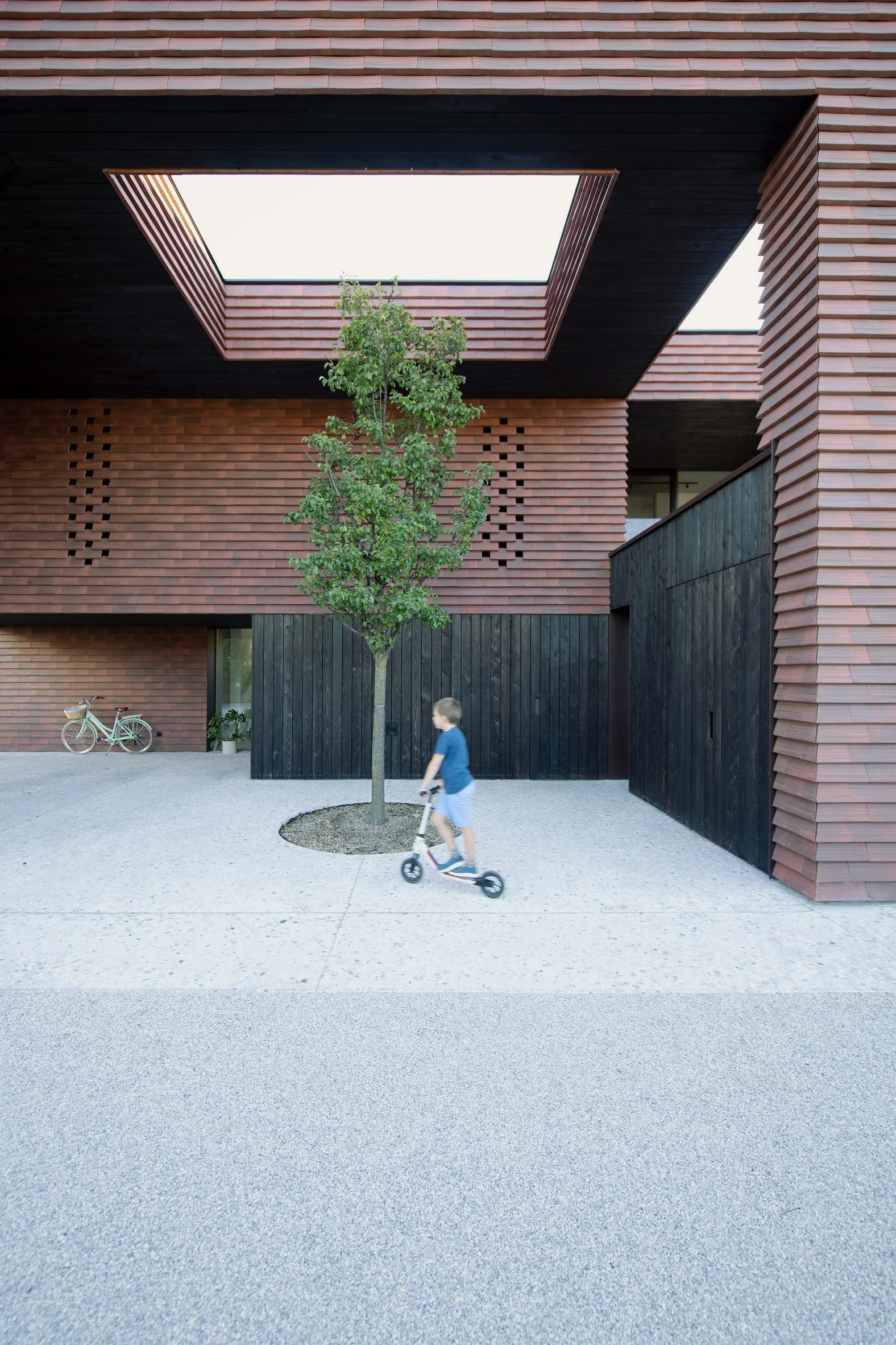 Exterior courtyard within Frame house in Slovenia