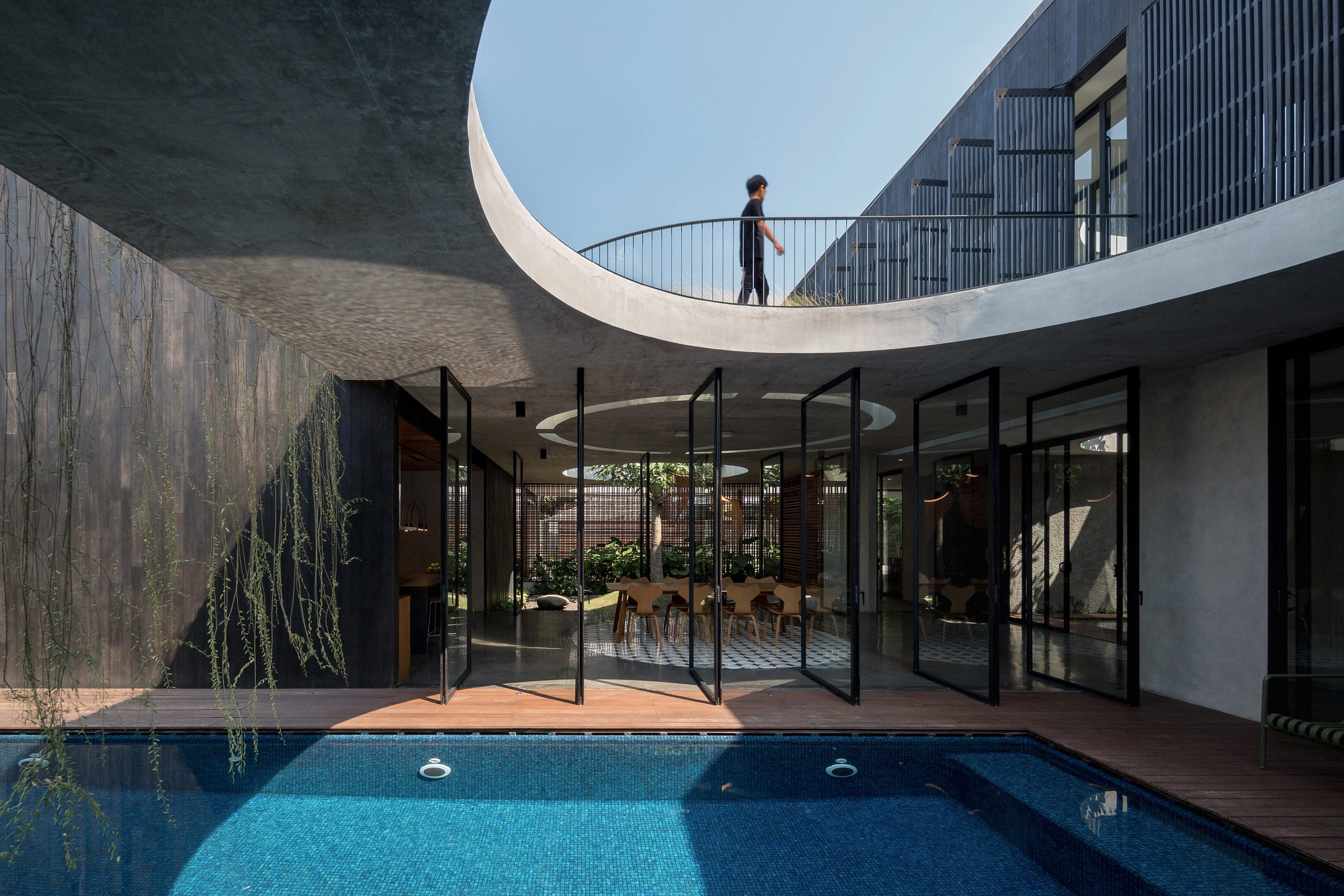 View across swimming pool at Halo House in Indonesia