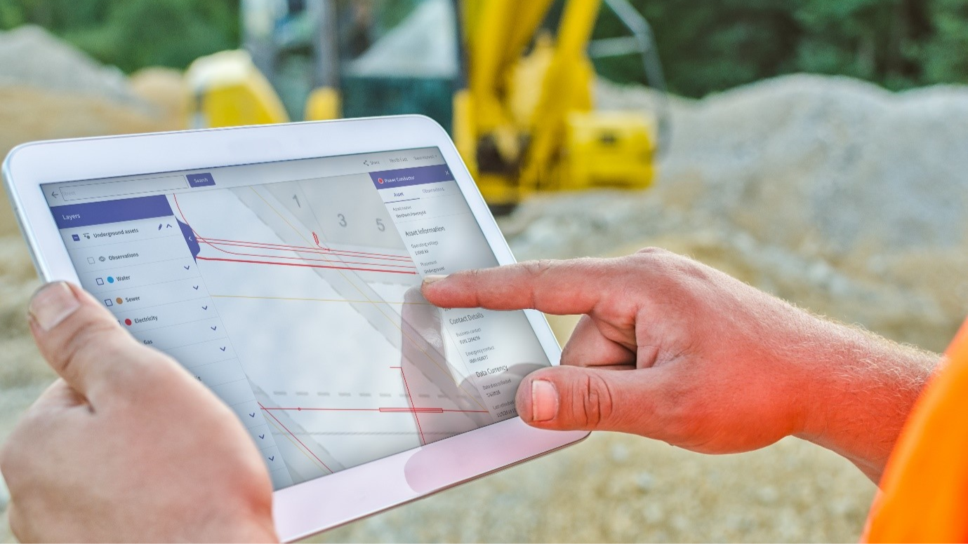 A worker using the National Underground Asset Register on a tablet - an interactive digital map of underground pipes and cables that will improve safe digging and put an end to accidental strikes. Health Safety and Wellbeing