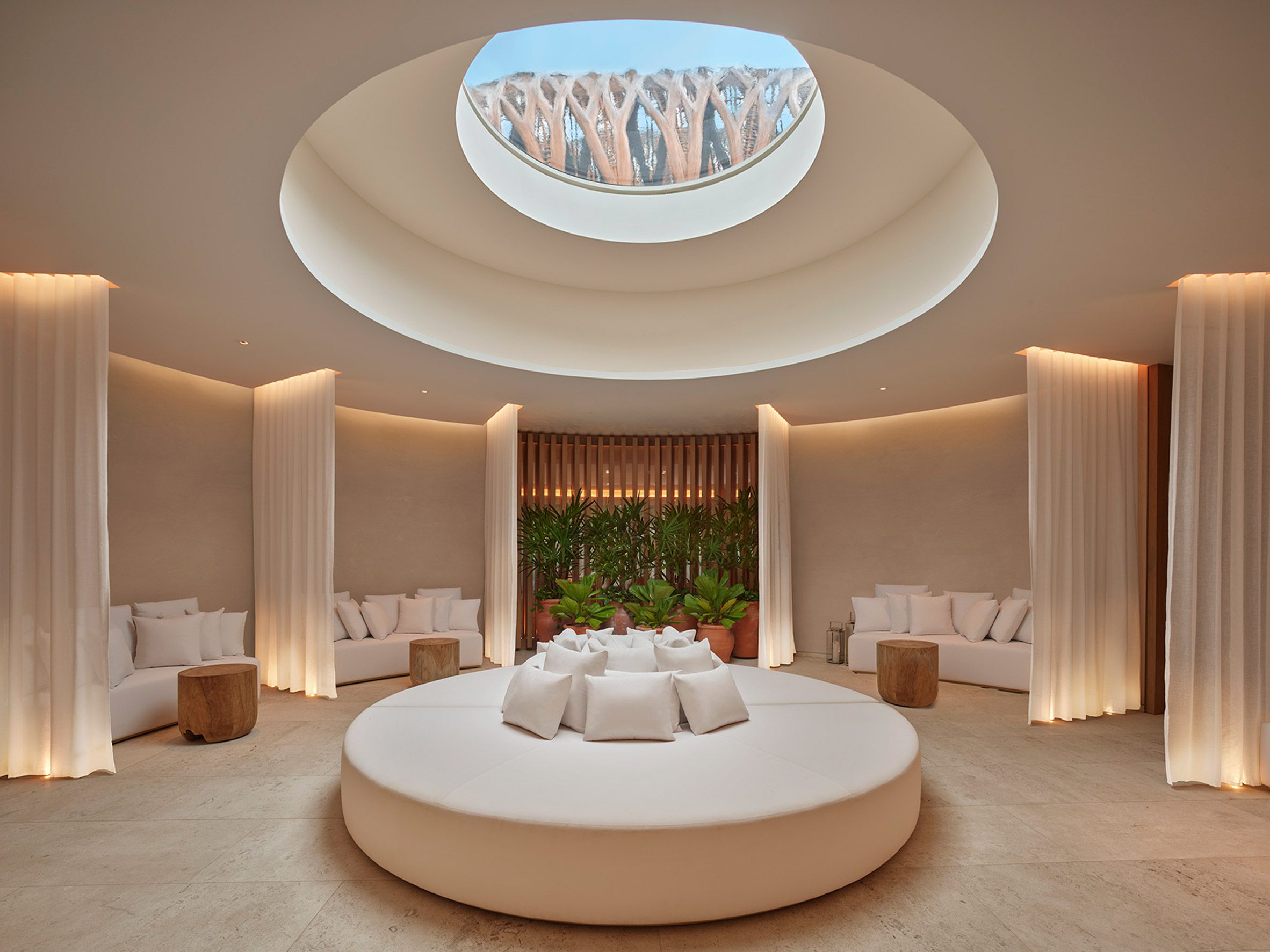 Spa below a reflecting pool that's visible through a skylight