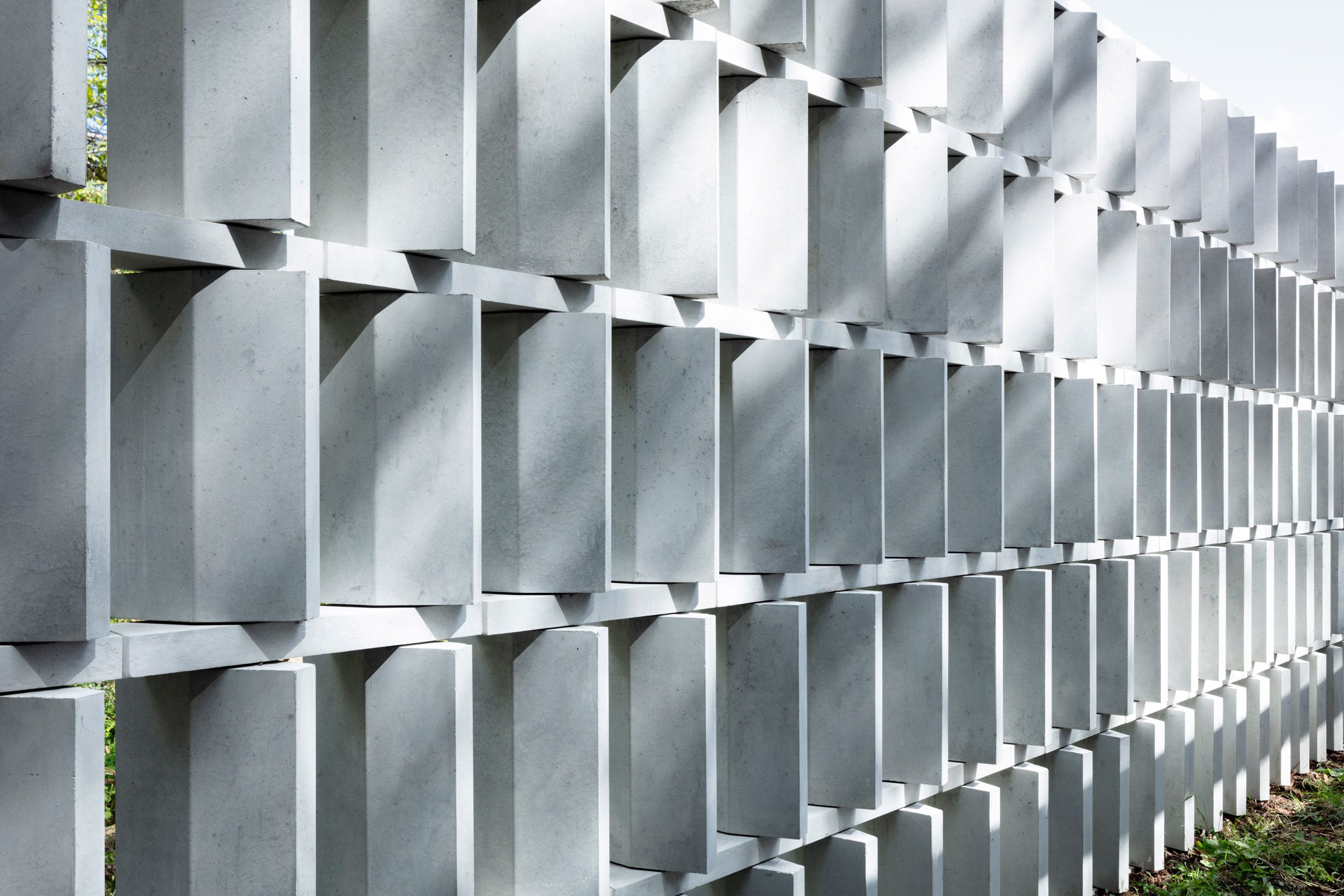 Close up of concrete screen within Block Wall House