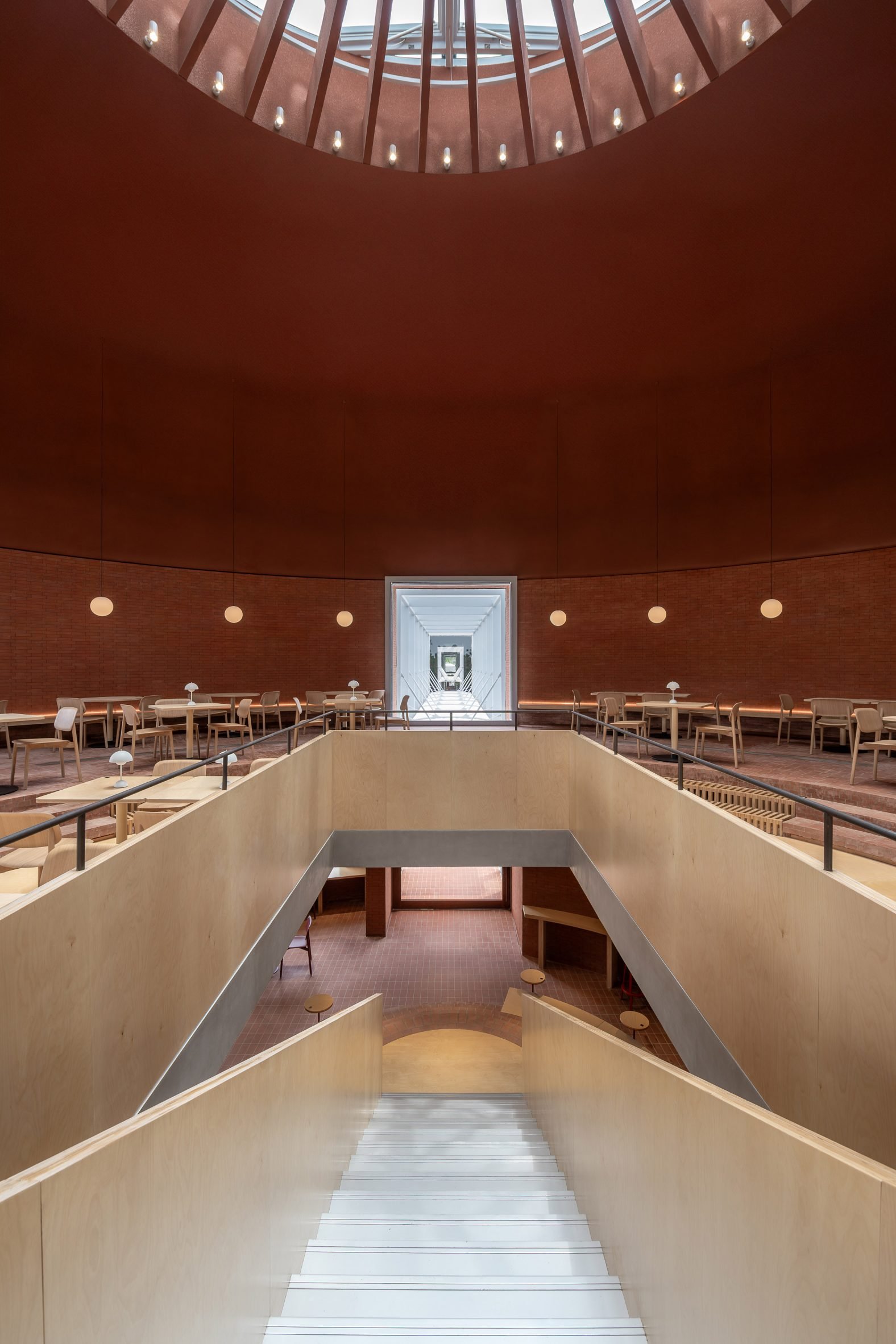 Restaurant interior at community space by AIM Architecture