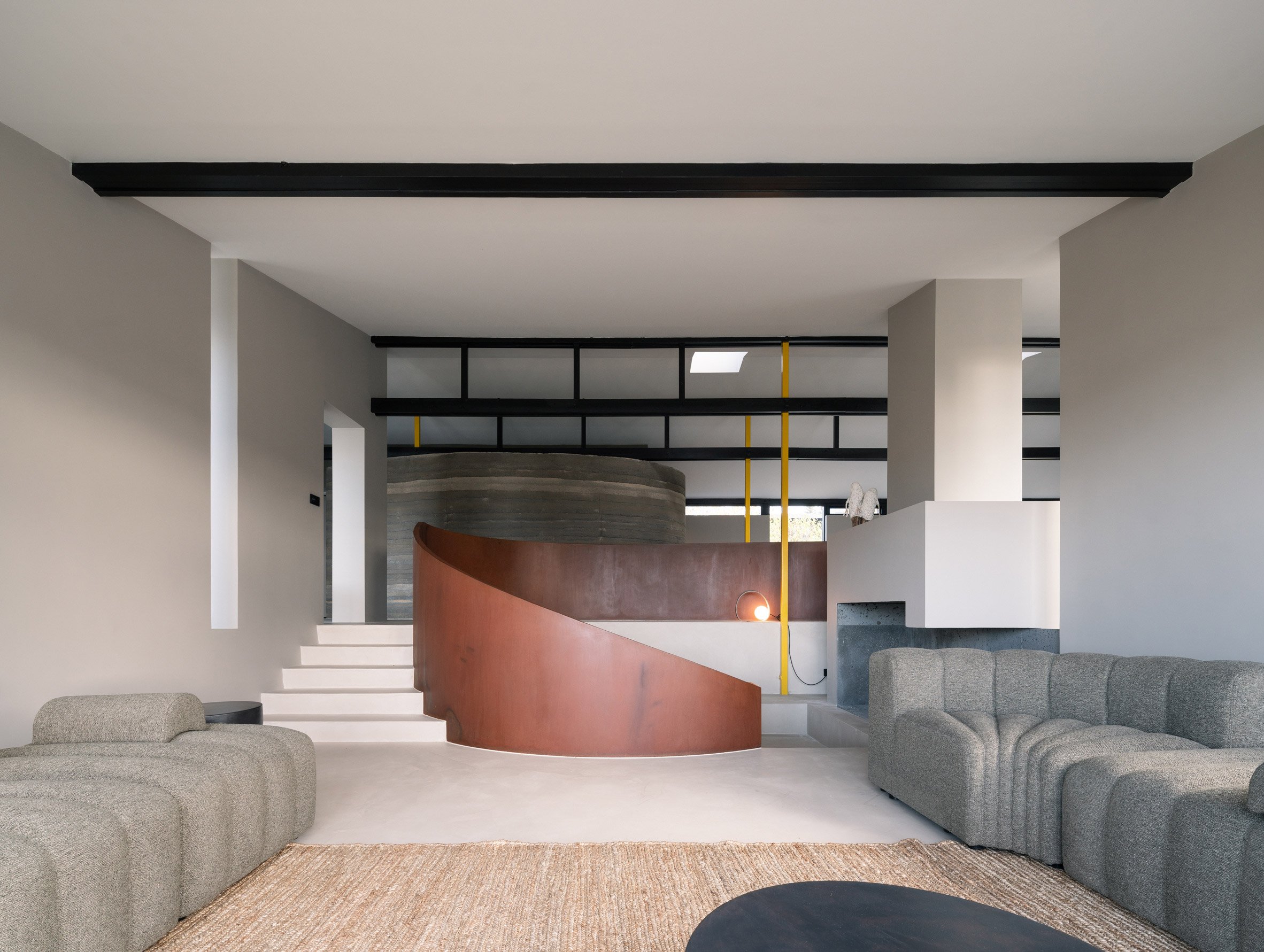 Living area within Curvilinear Serenity home in Iceland