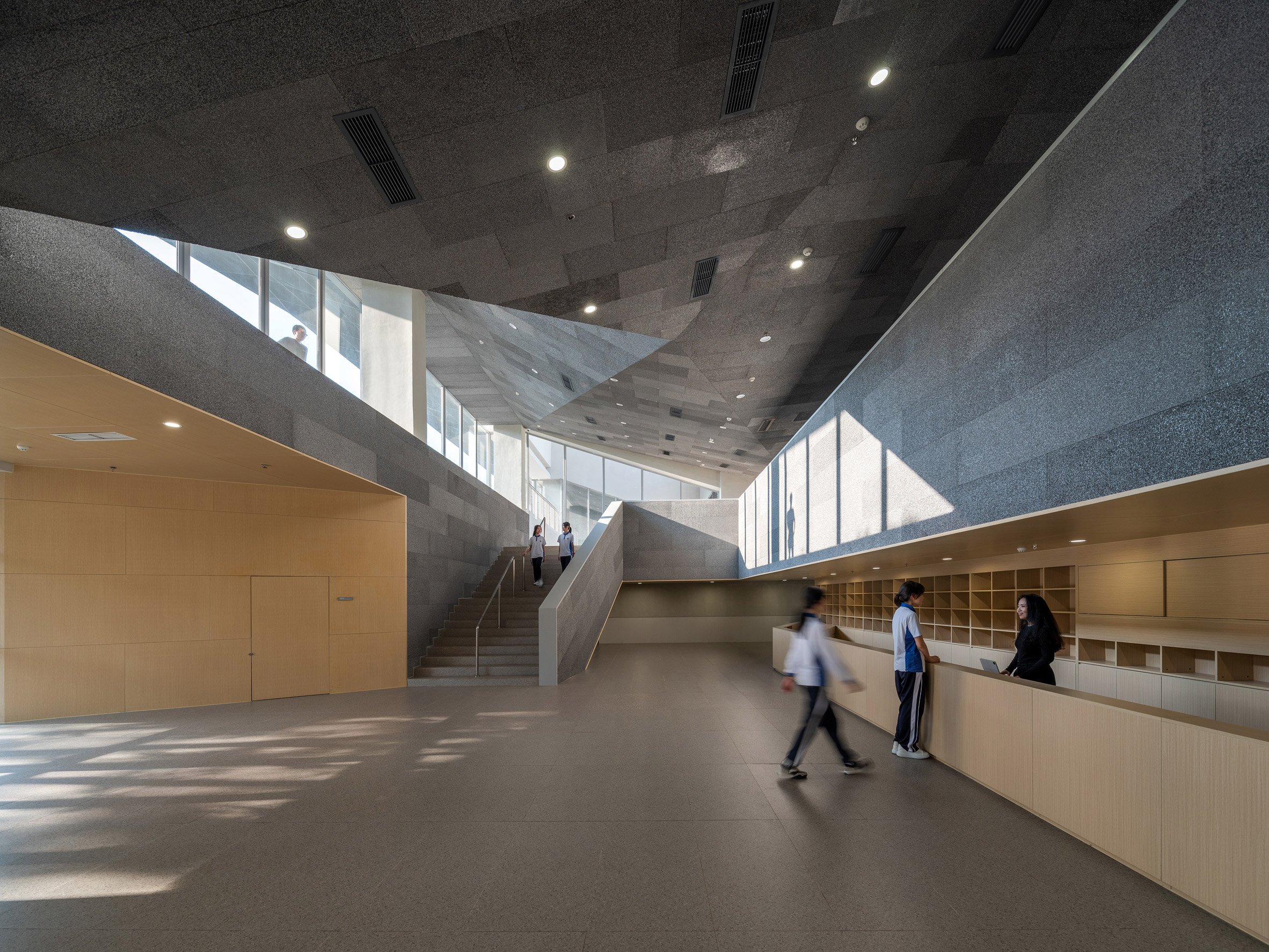Lobby within educational building by Remix Studio