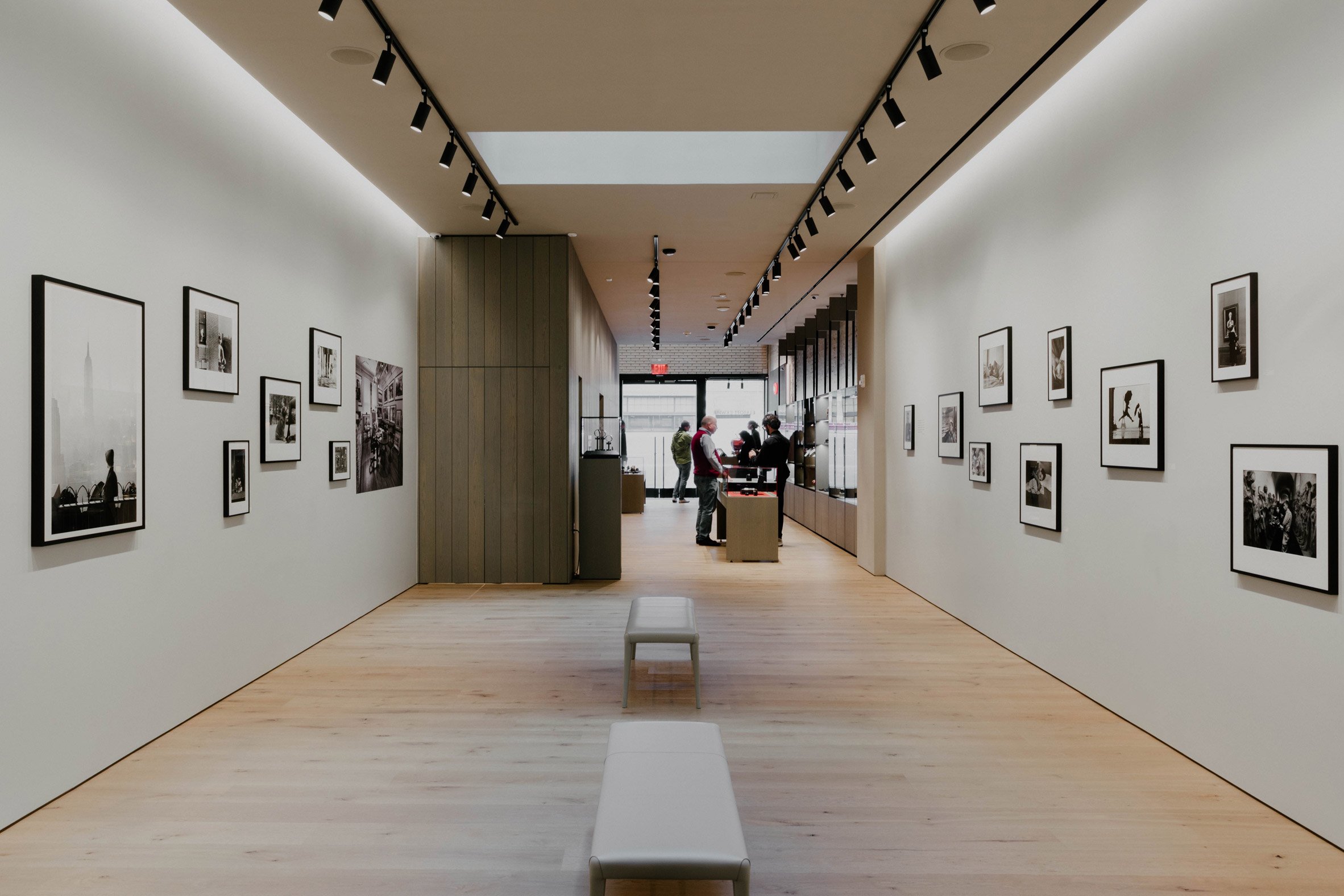 View of retail space with wood panelling and glass vitrines