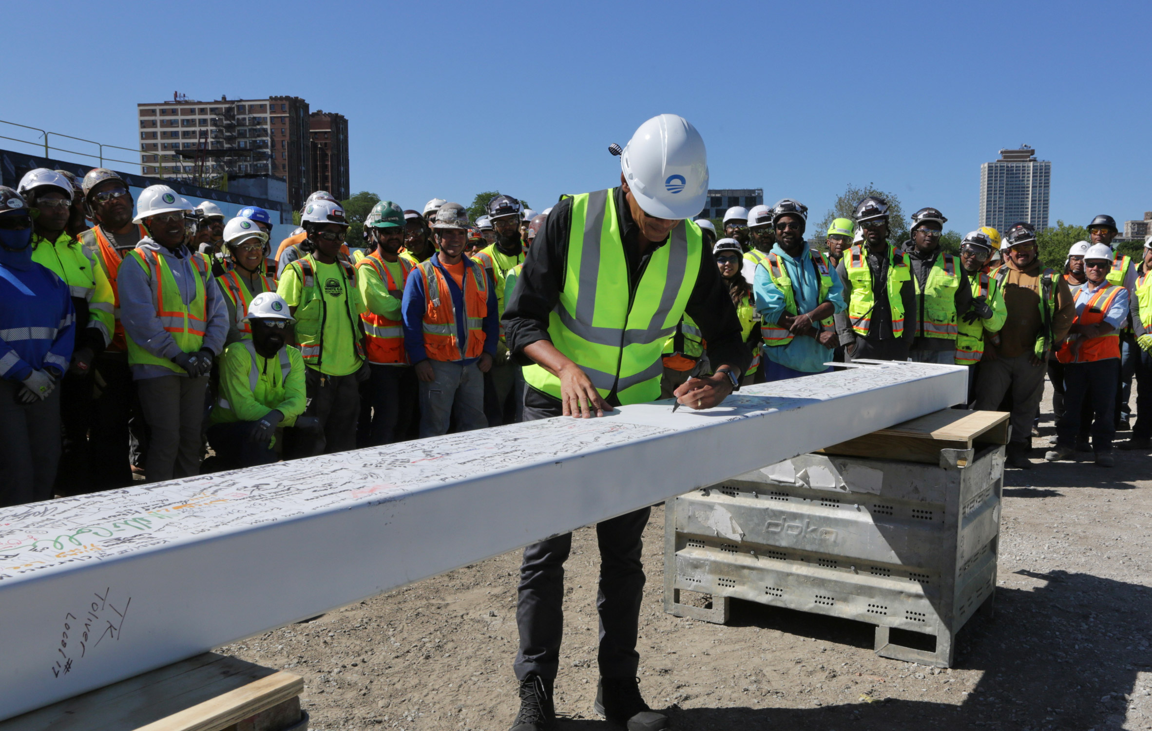 Obama signing a beam