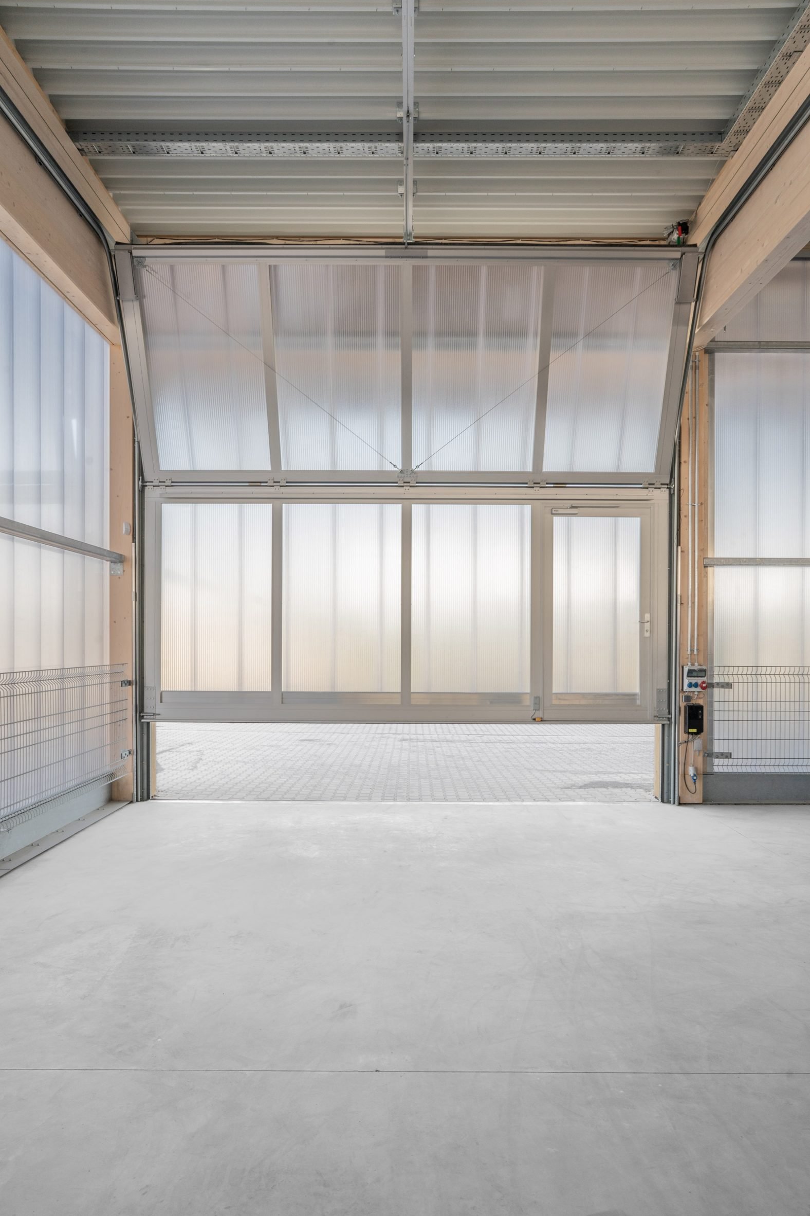 Opening within timber and polucarbonate warehouse in Germany
