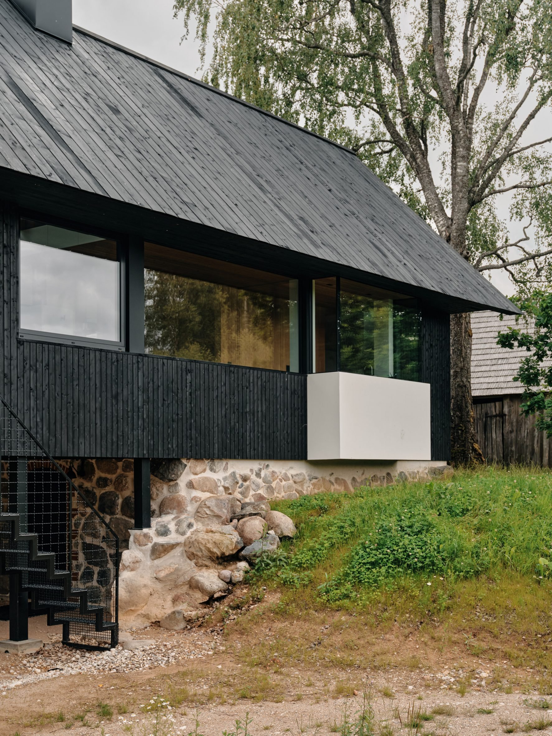 Timber home sat atop basement by Hanna Karits and Mari Hunt