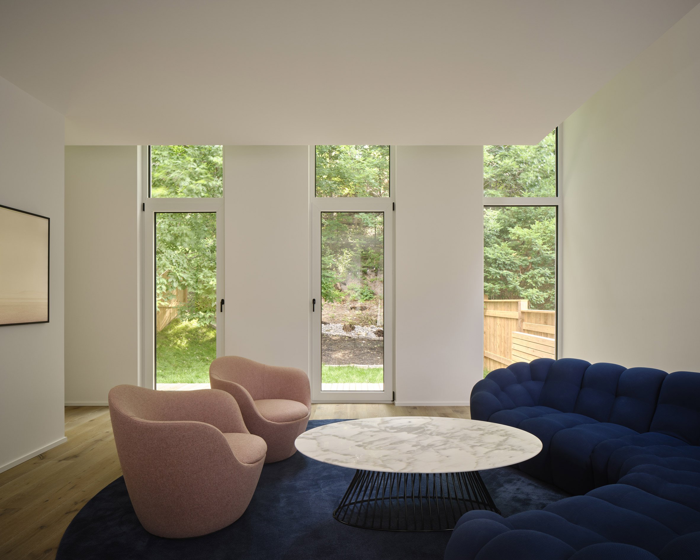 Living room with curved blue sofa