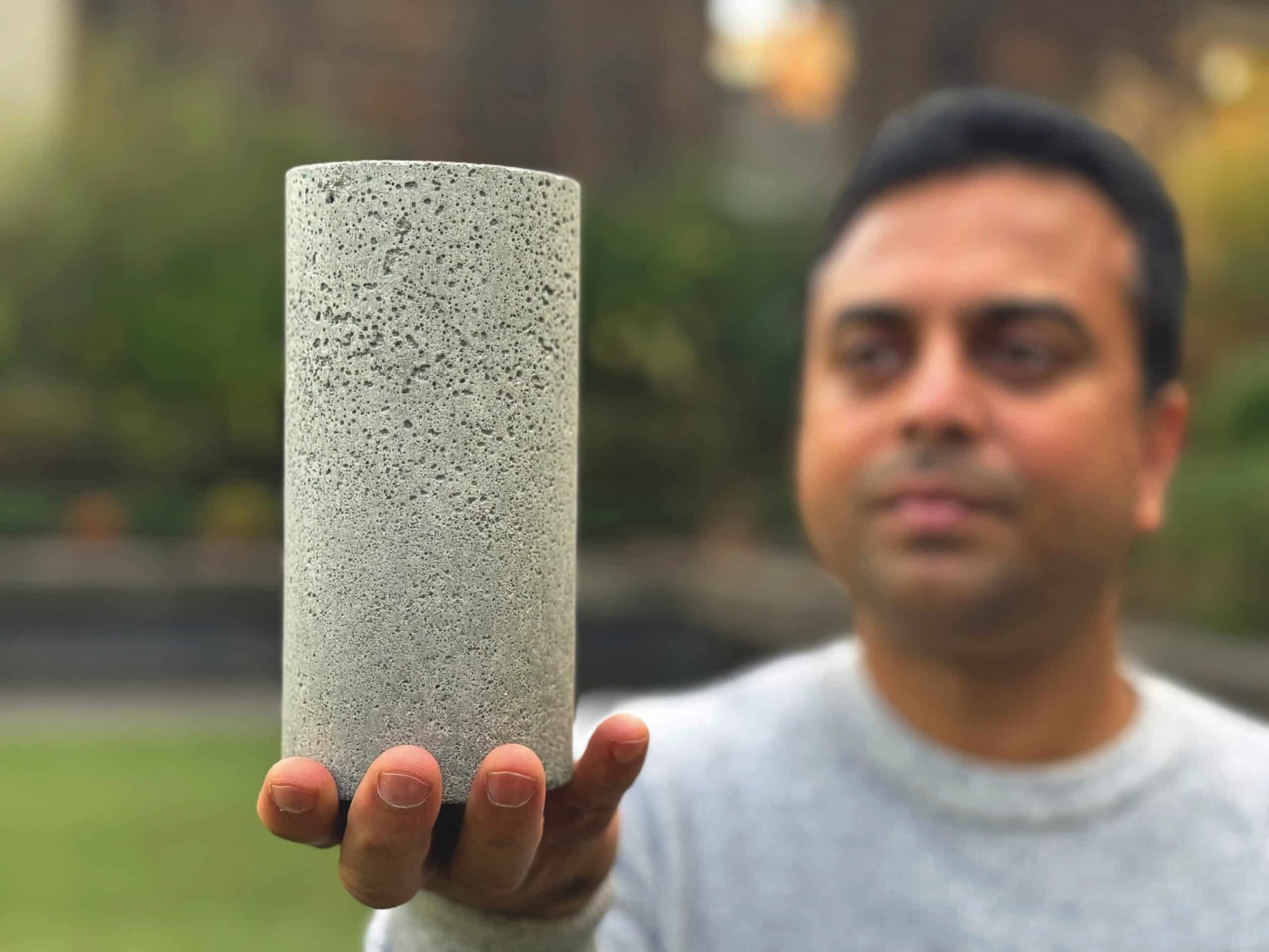Dr Chamila Gunasekara holds a sample of one of the team’s low carbon concrete blends.