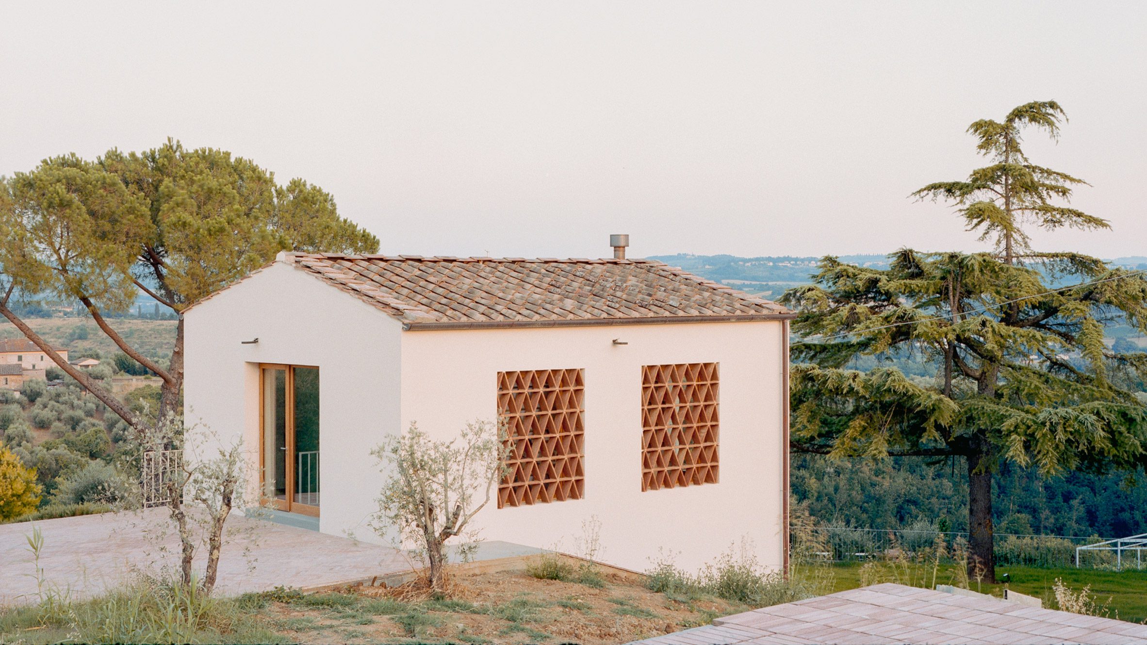 Florentine barn conversion with geometric windows
