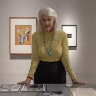 Penelope Seidler standing in exhibition space