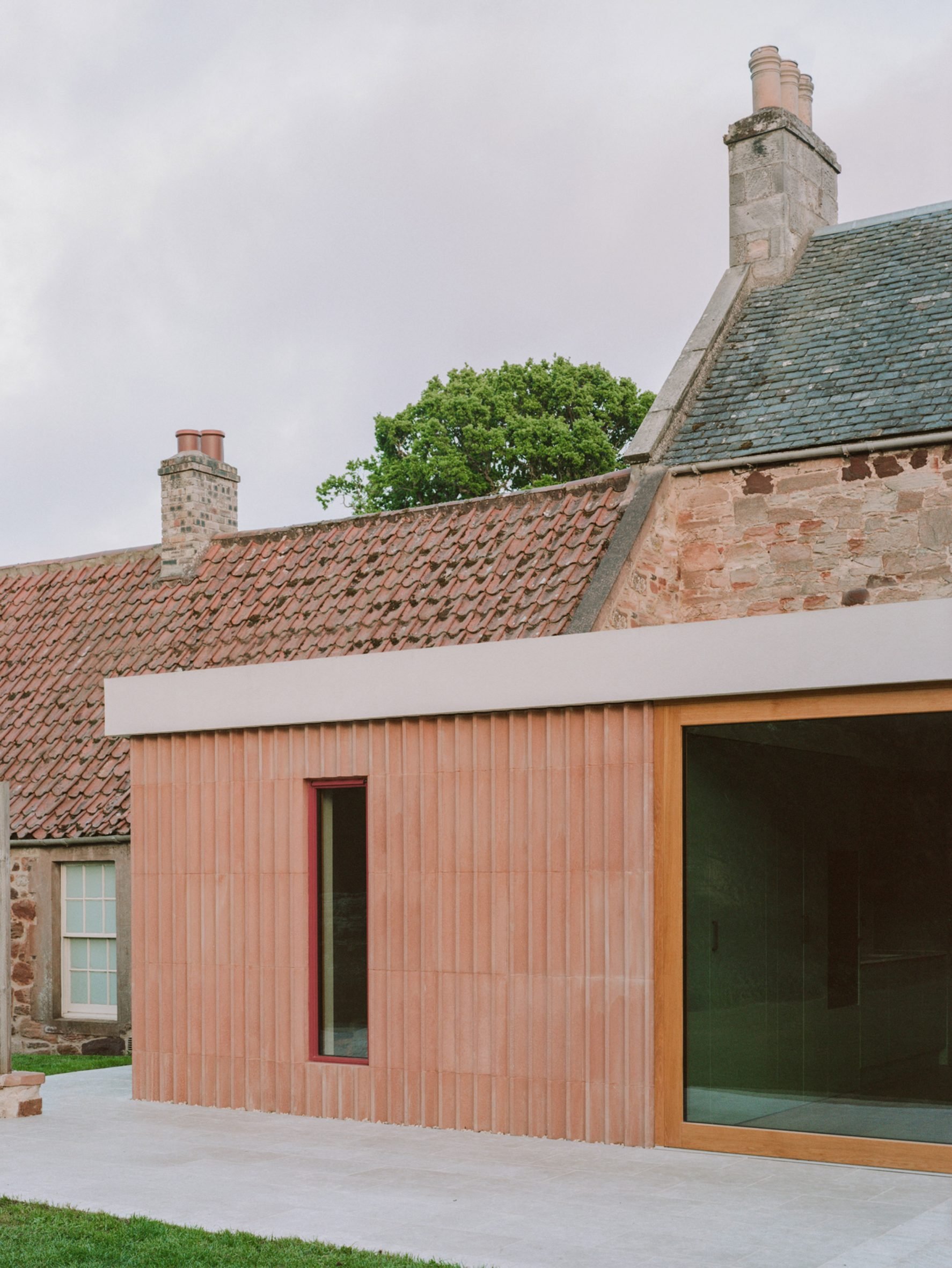 Exterior view of farmhouse extension by Pend
