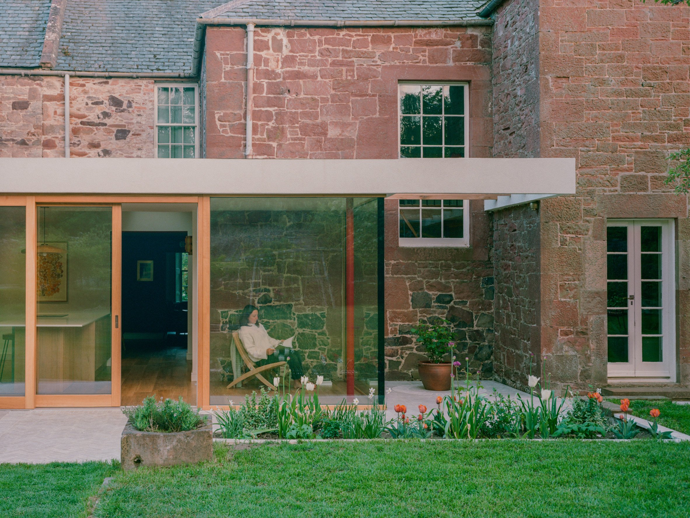 View from garden at stone-clad extension by Pend