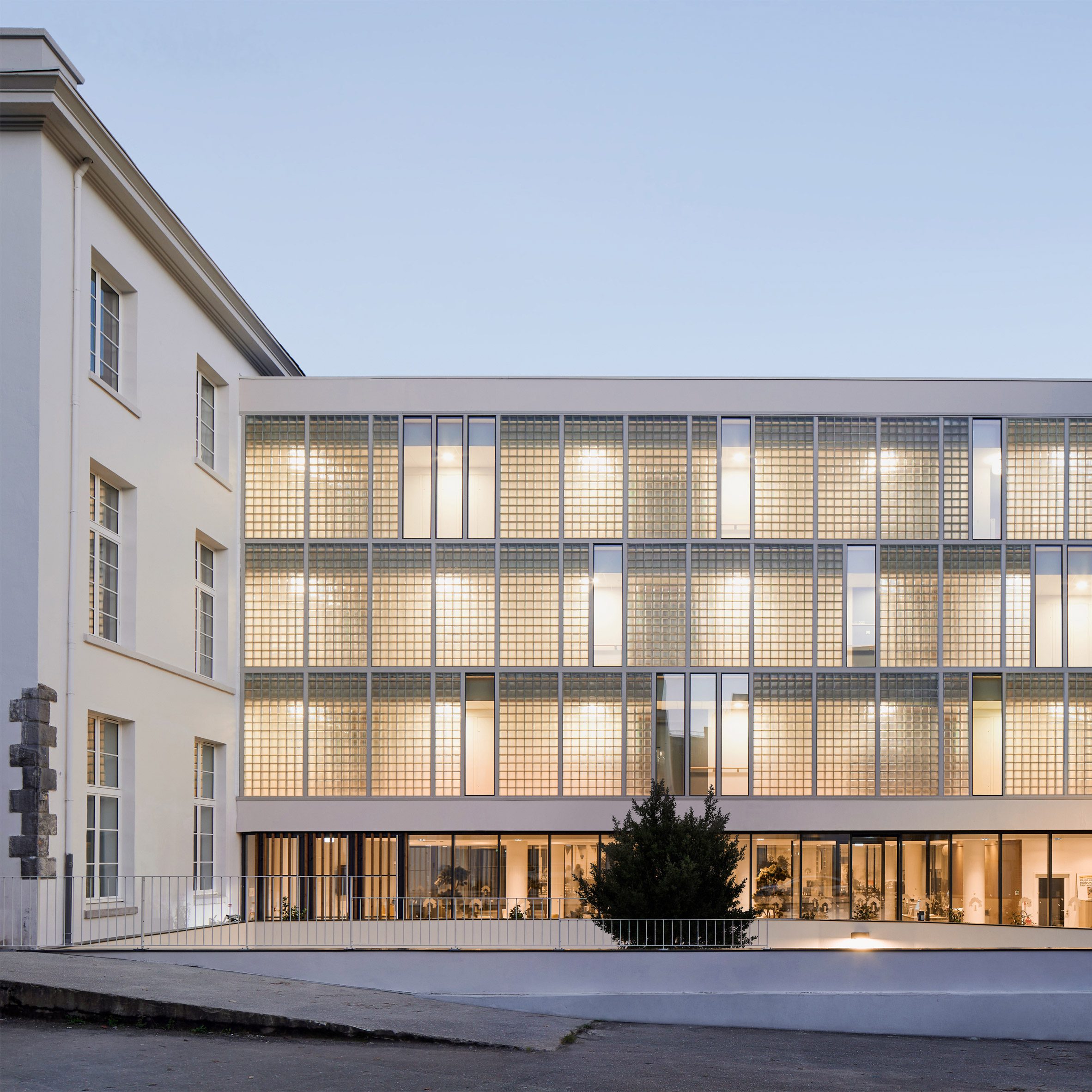 Glass-brick facade at Brest Post Office flat conversion in Brittany by Chatillon Architectes