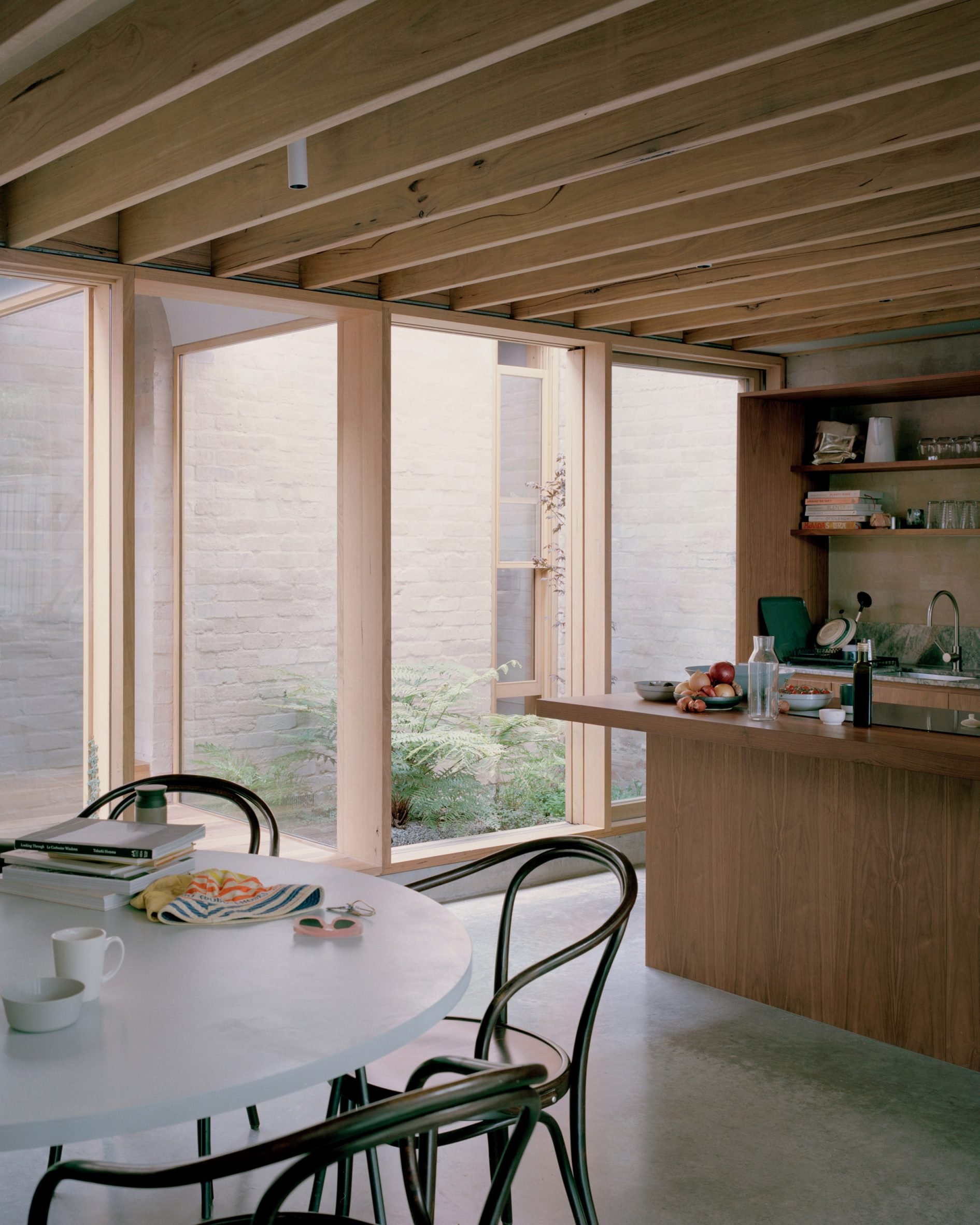 Kitchen overlooking an outdoor patio in Victoria