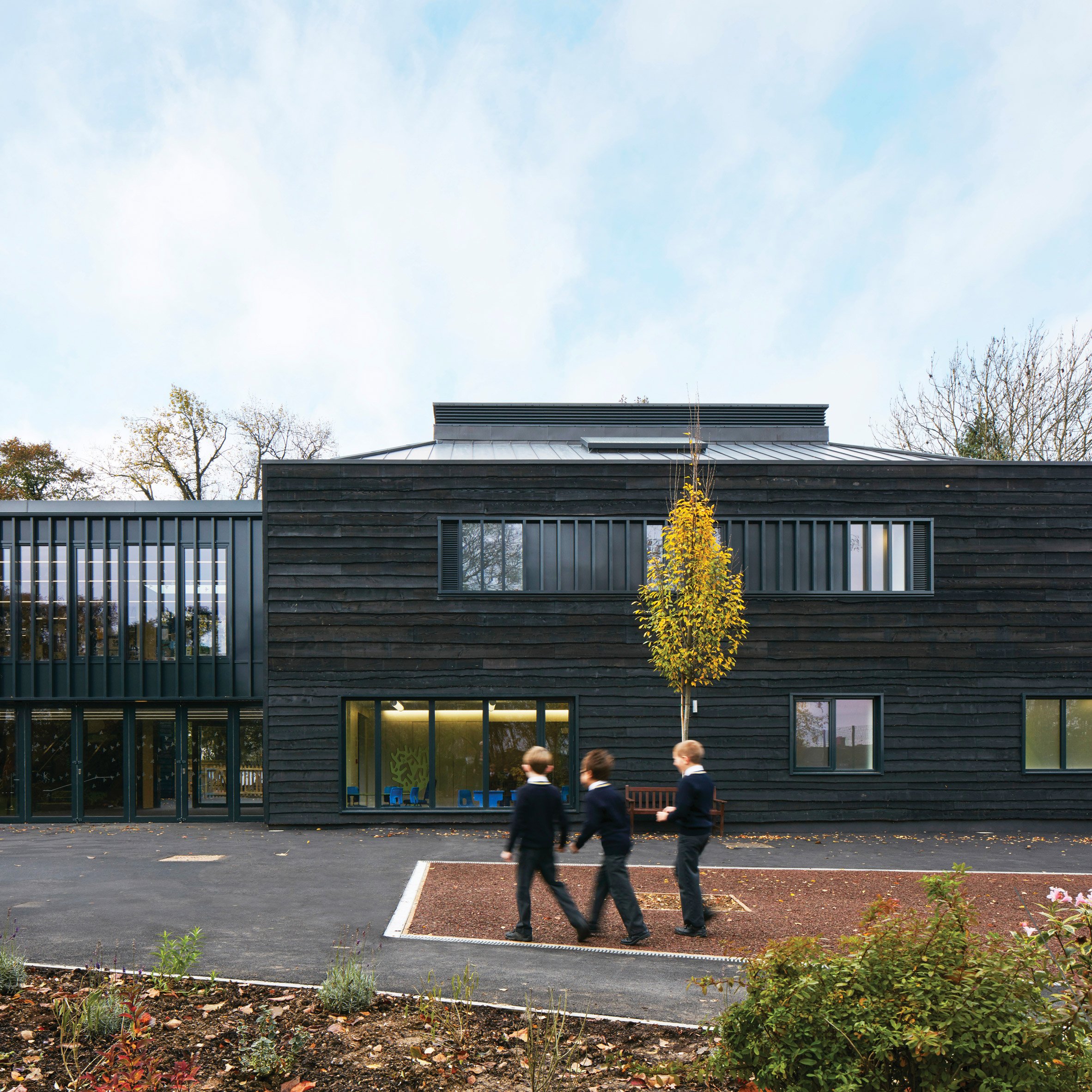 Rough-sawn timber facade of British school