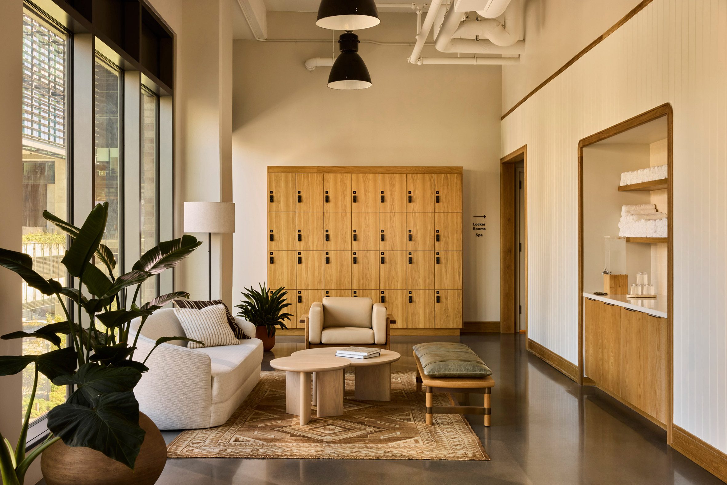 Fitness centre with a neutral palette and polished concrete floors