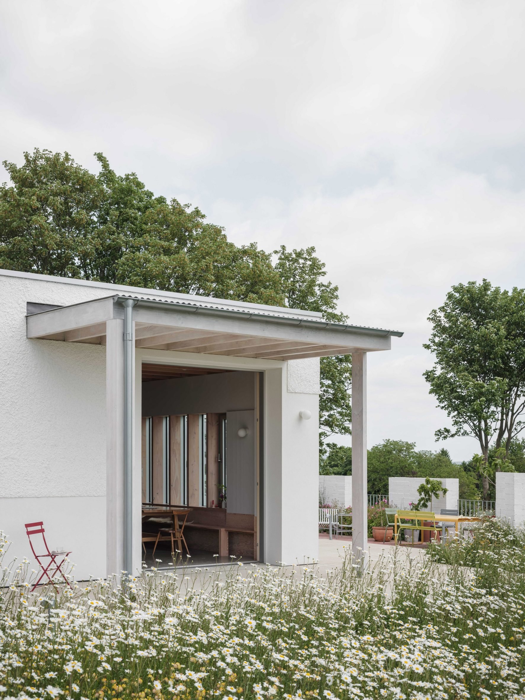 Exterior view of renovated home by Medium