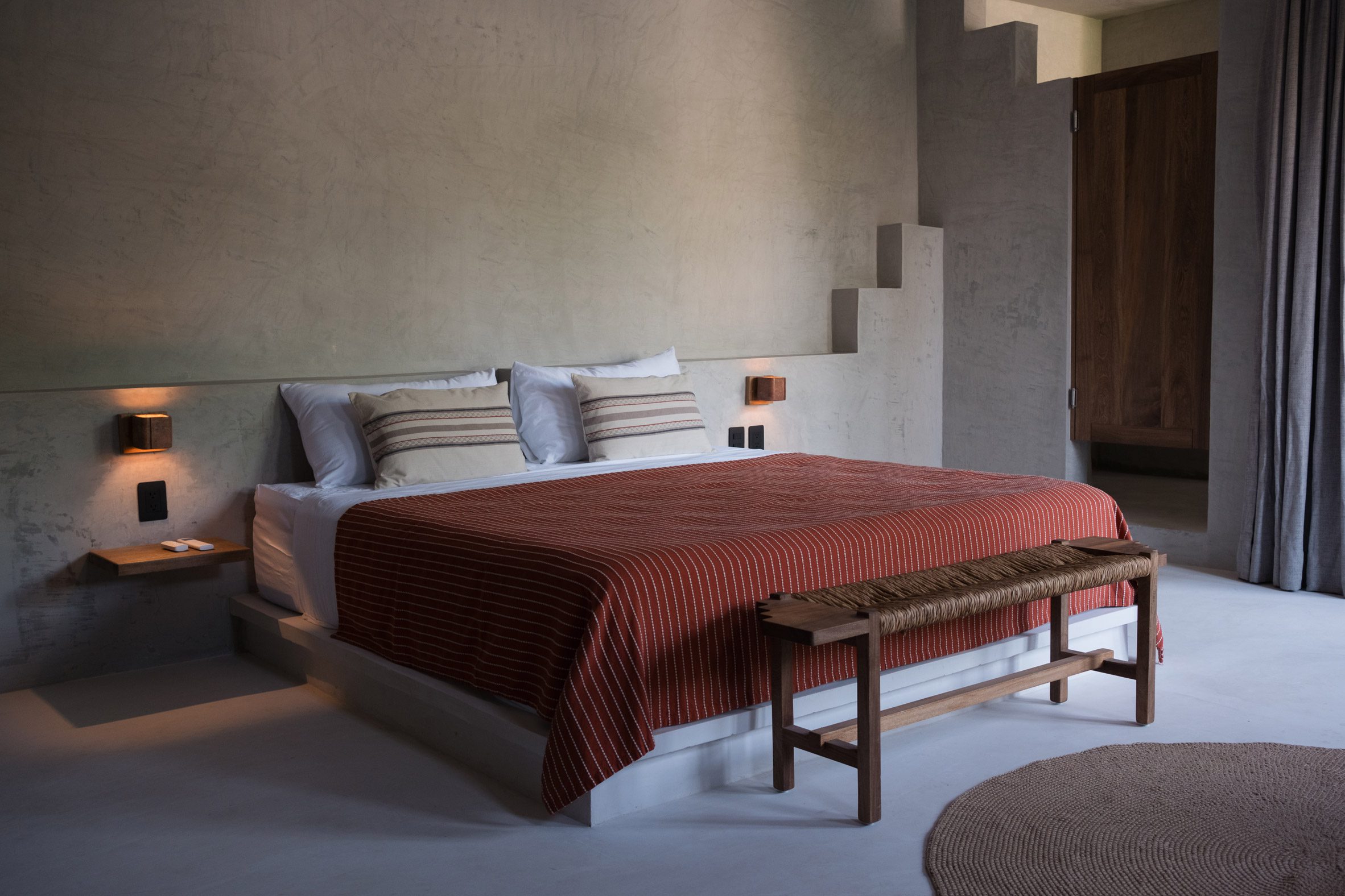 Bedroom with a stepped motif along the tops of walls