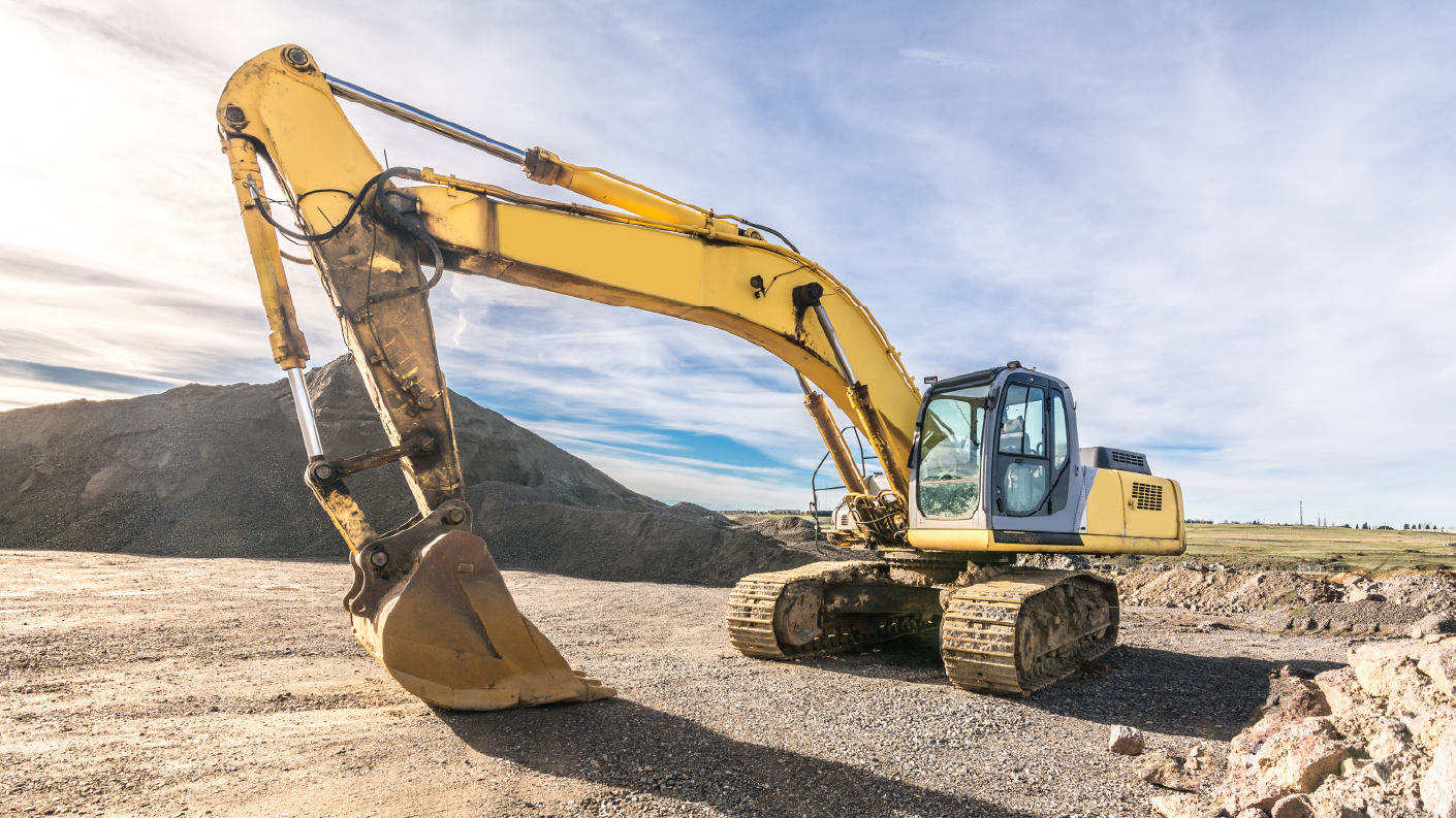 A yellow excavator on a construction work site
