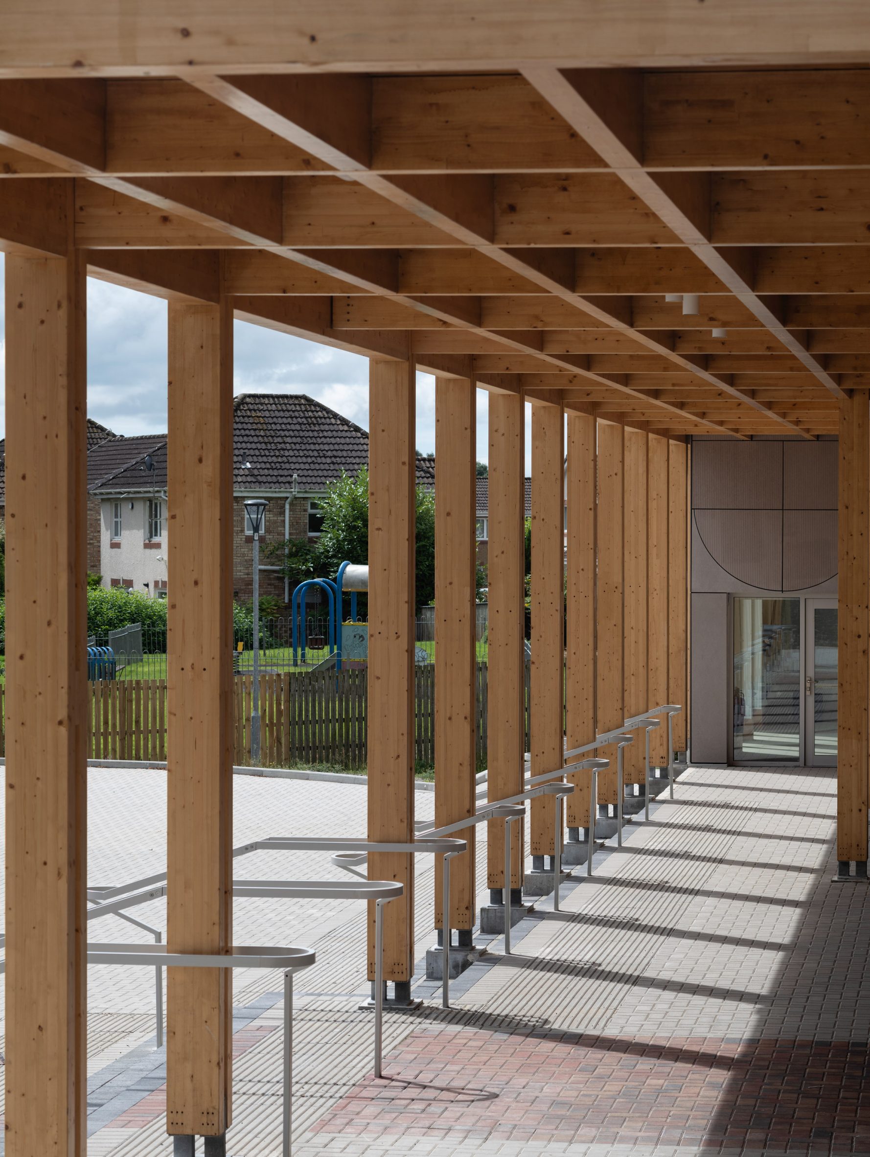 Timber colonnade outside Kilmarnock's Take A Bow centre