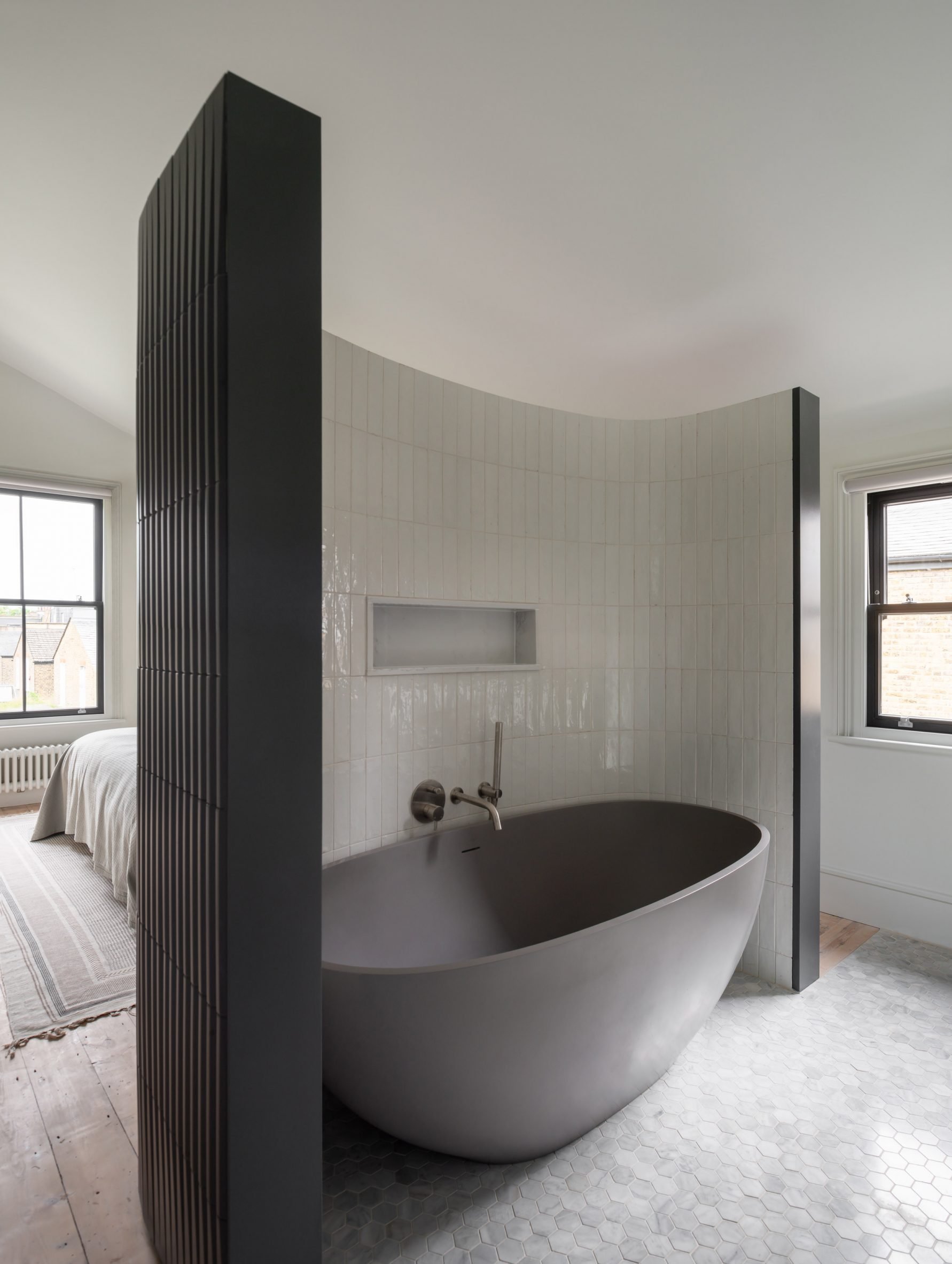 Freestanding bathtub in bedroom