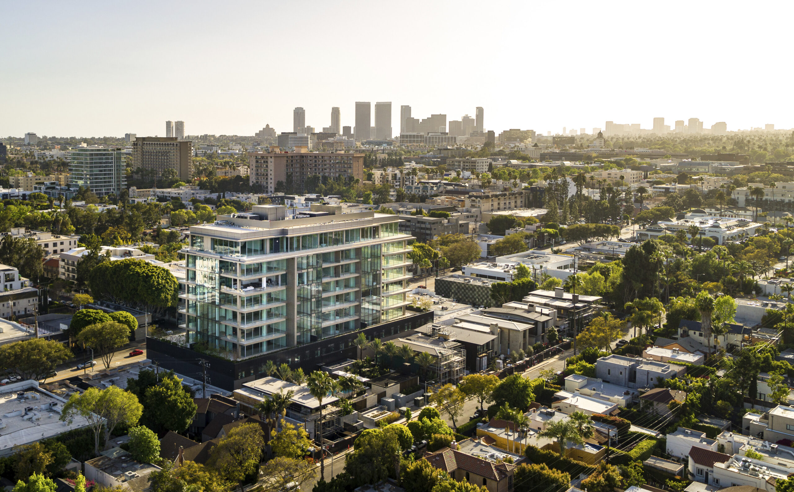 Adaptive reuse of 1960s office tower into modern residences by Olson Kundig in Los Angeles.