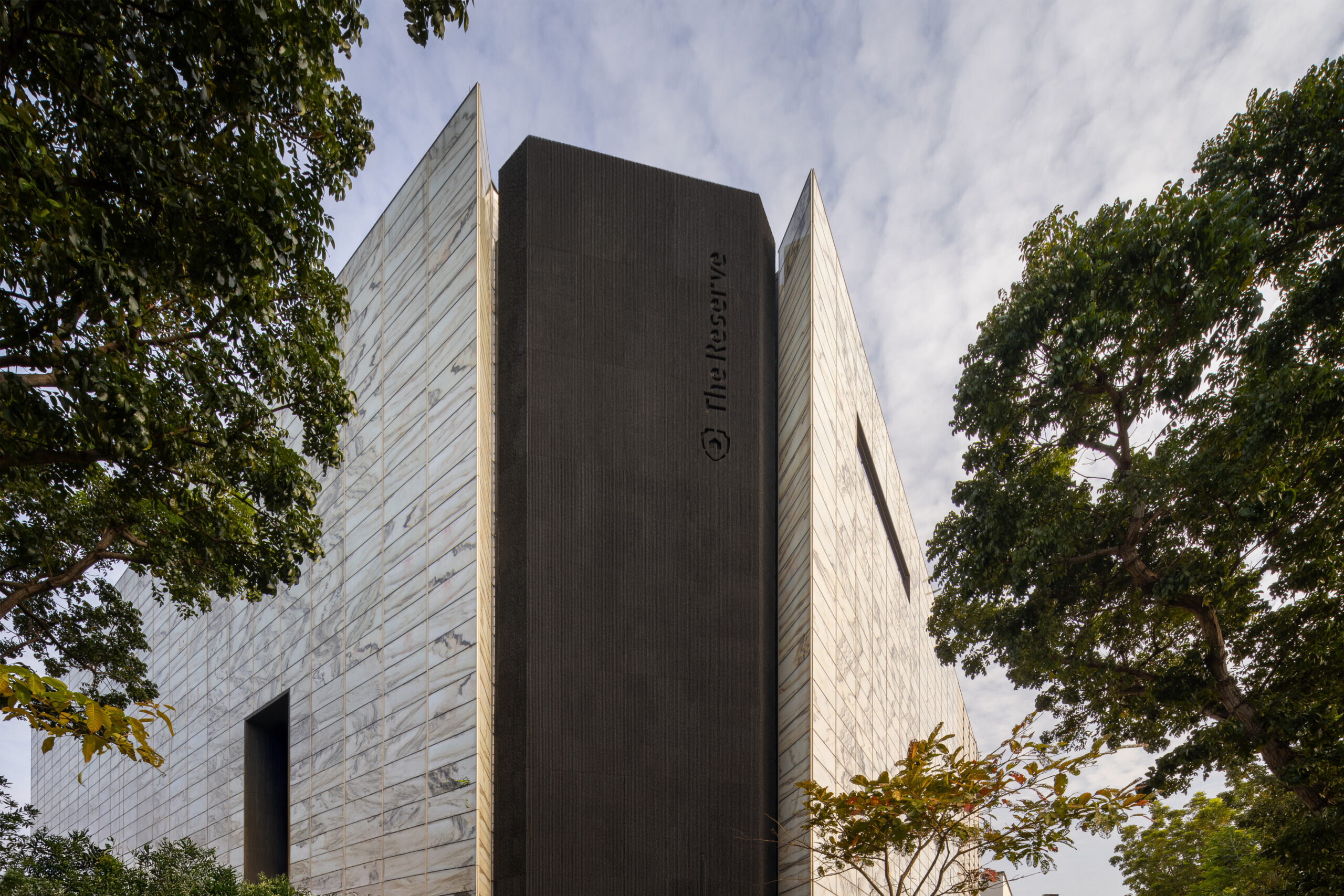 Adaptive reuse of old electronics warehouse into modern vault by Monolab Studio in Singapore.