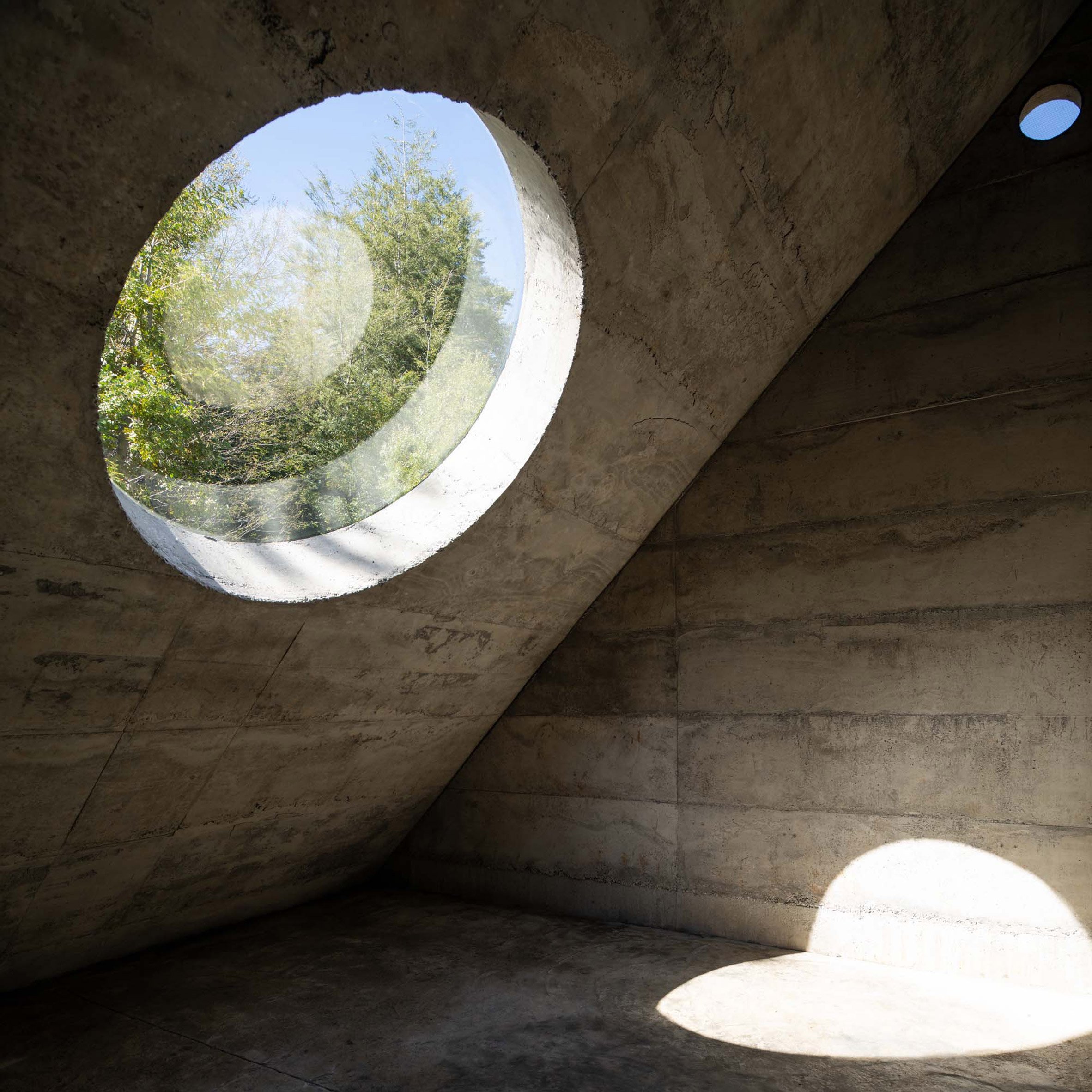 Oculus inside concrete Miel Pavilion by Pezo von Ellrichshausen