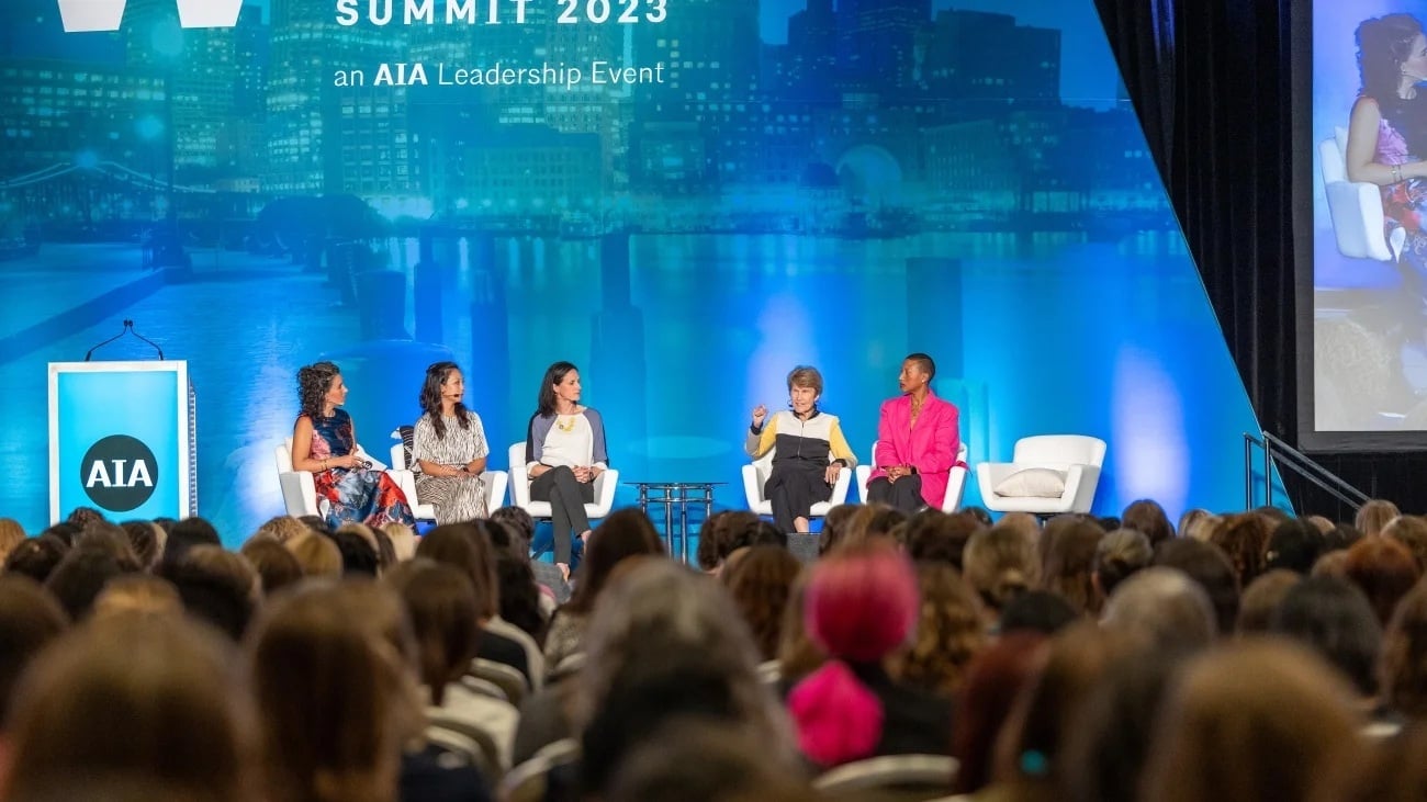 A panel of 5 speakers are on stage at the 2023 AIA Women's Leadership Summit (Photo: AIA)